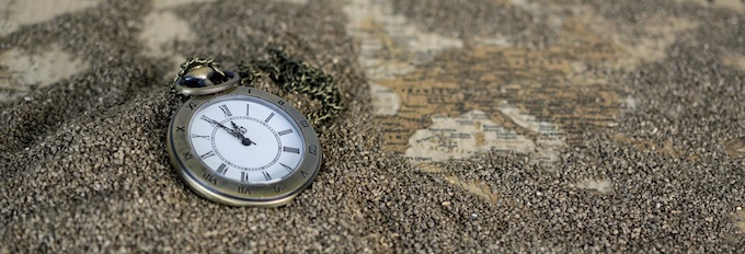 Pocket Watch Lying on a Global Map [Friday Casino Observations]