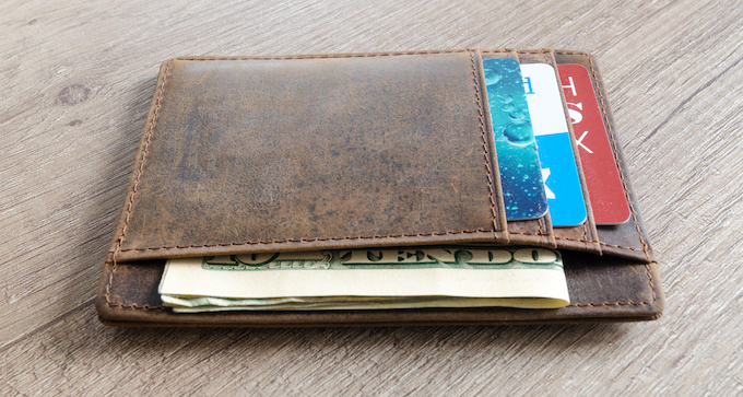 Wallet showing cash and holding credit cards [Casino Safety]