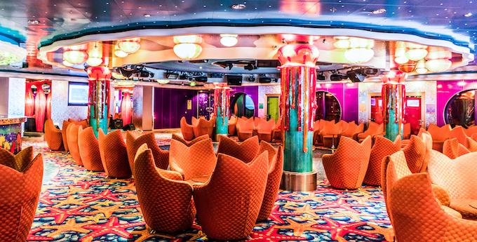 Lounge area on the Norwegian Jade cruise ship [Car Playing Slots]