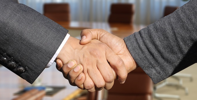 Business people’s handshake [Kept Secret]