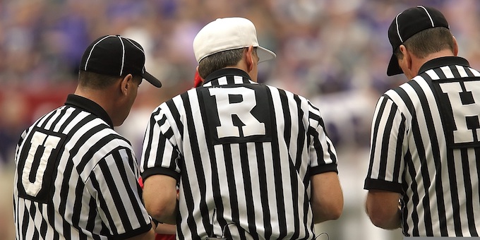 Football game referees coming to a decision [Your Emotions Matter]